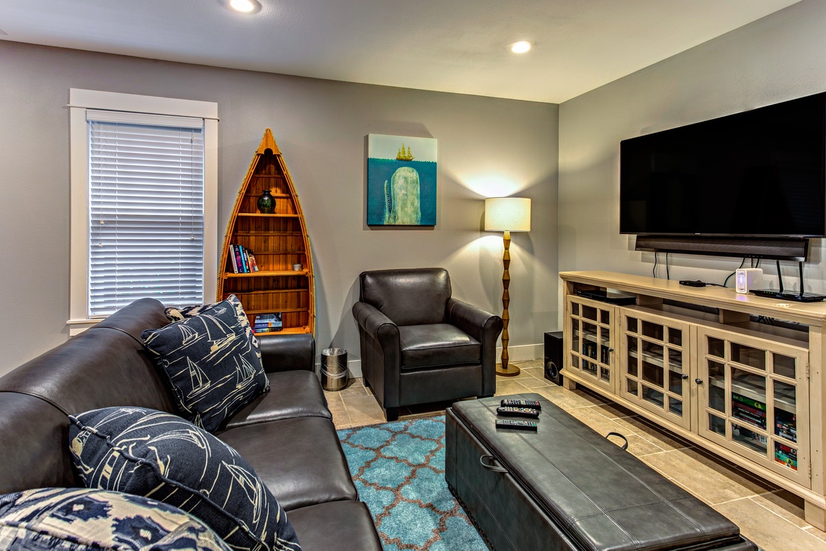 Entertainment area in daylight basement primary suite