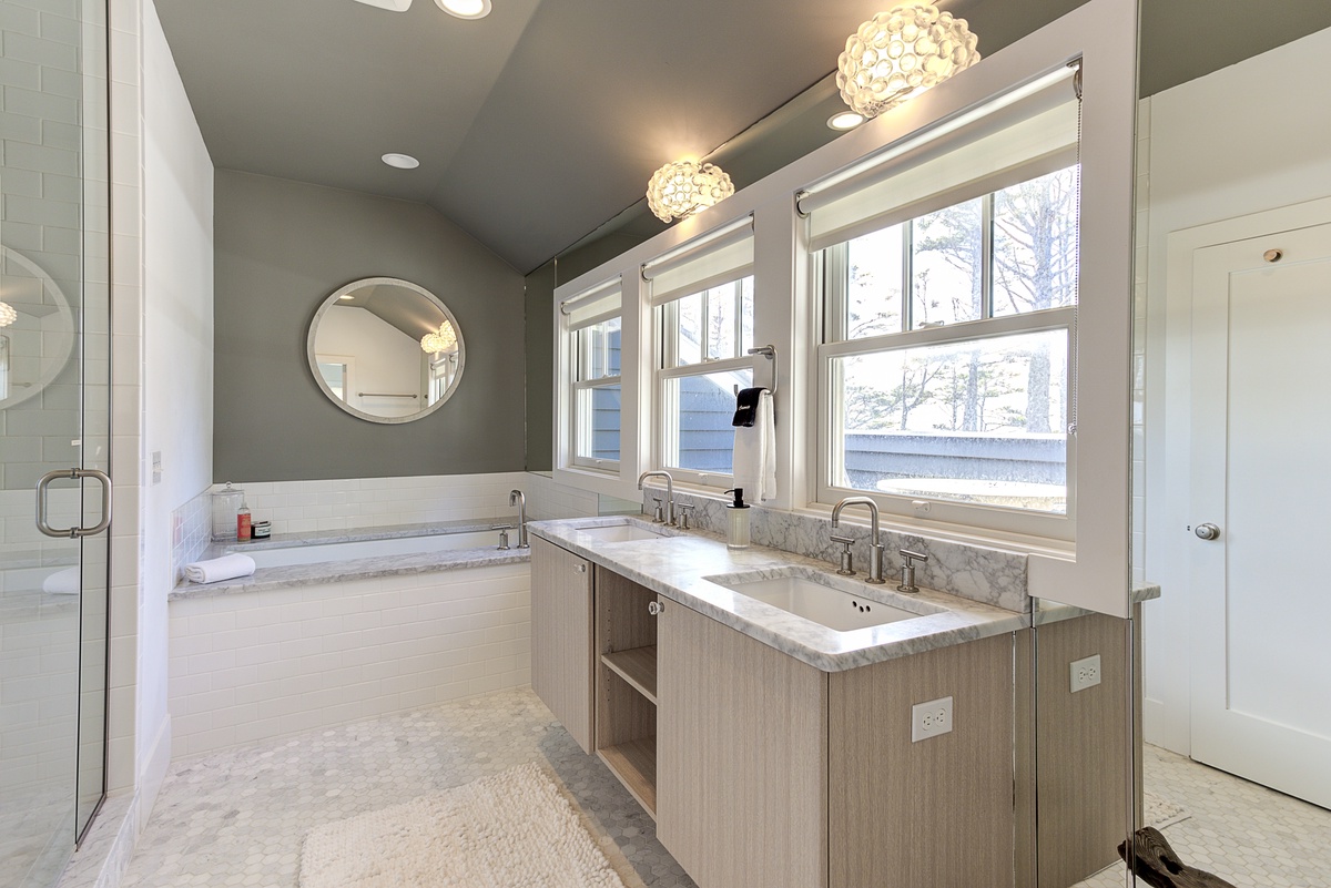 Primary bathroom with ocean view soaking tub and steam shower