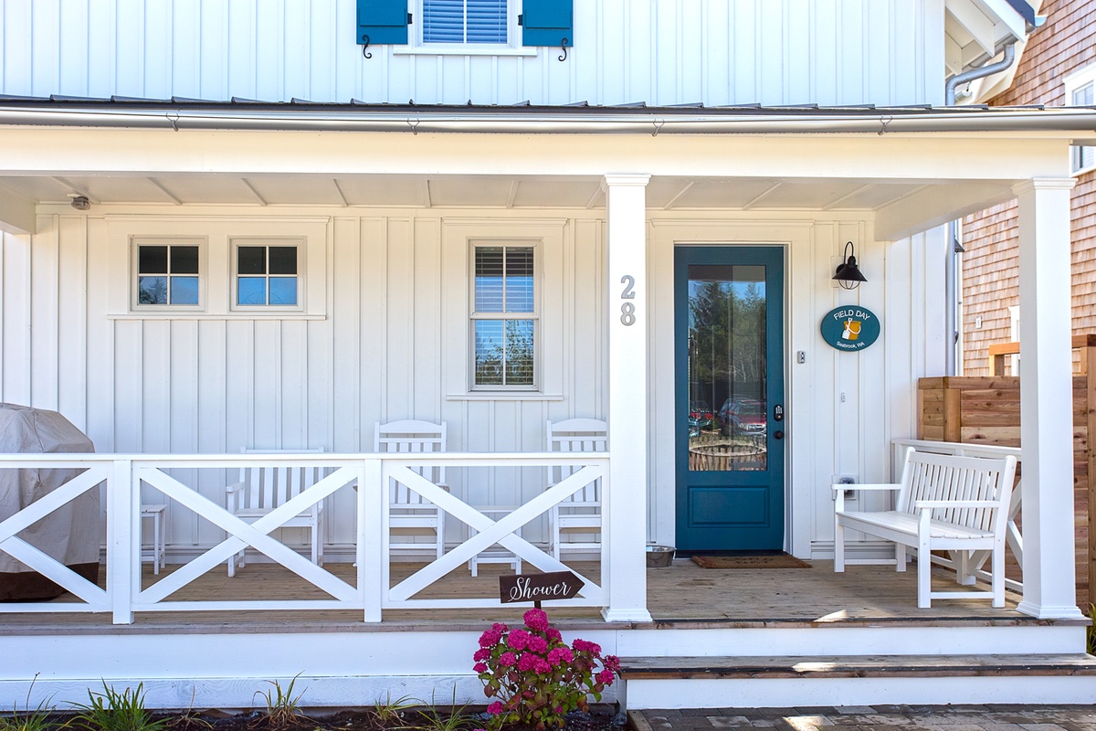 Outdoor seating and grill on back deck