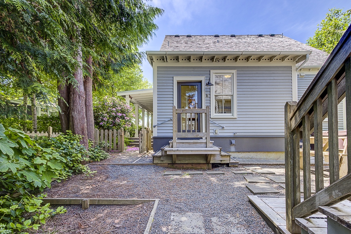 View of back of the home, carriage house to your right