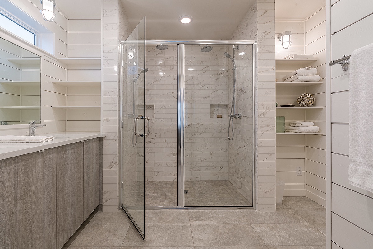 Primary ensuite bathroom with dual head shower
