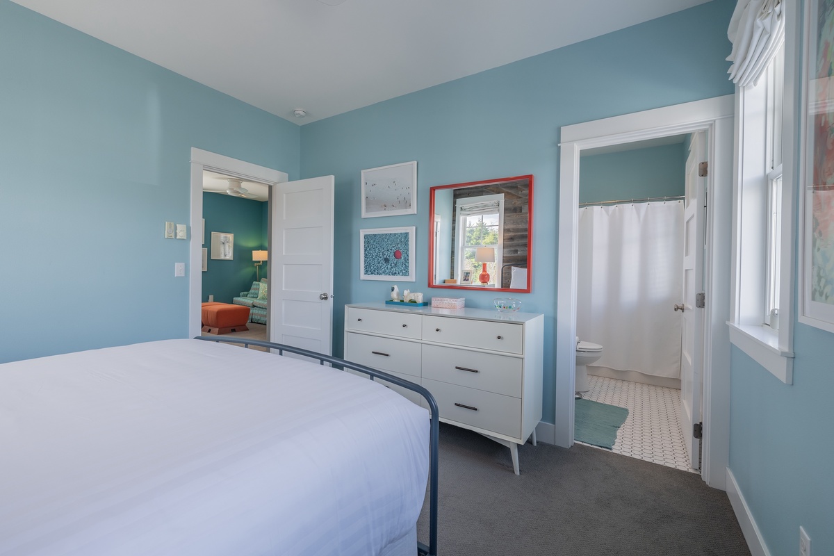 Primary bedroom with ensuite bathroom is designed for relaxation