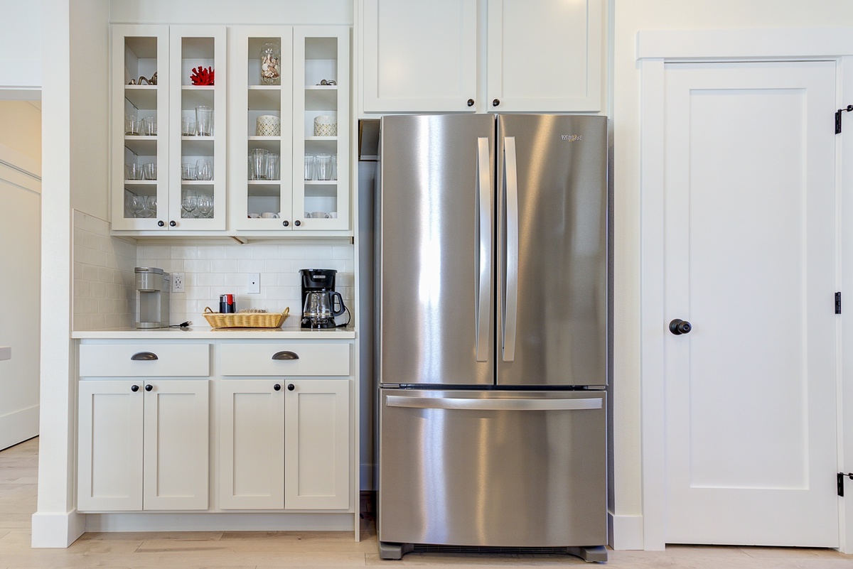 The kitchen has charming glass cupboards