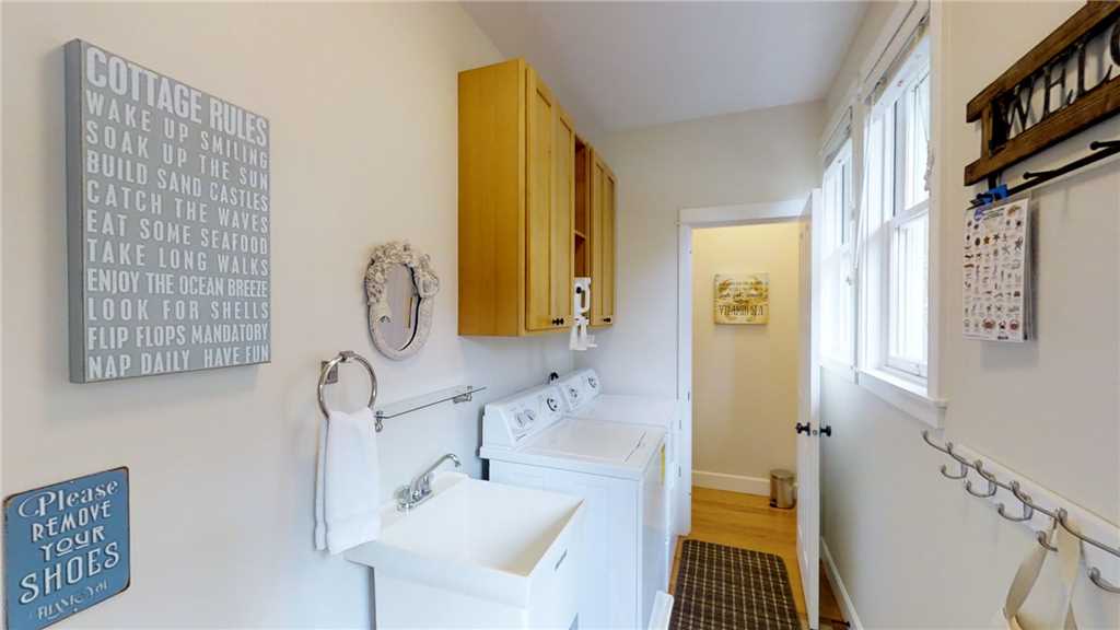 Mudroom with a washer and dryer and powder room