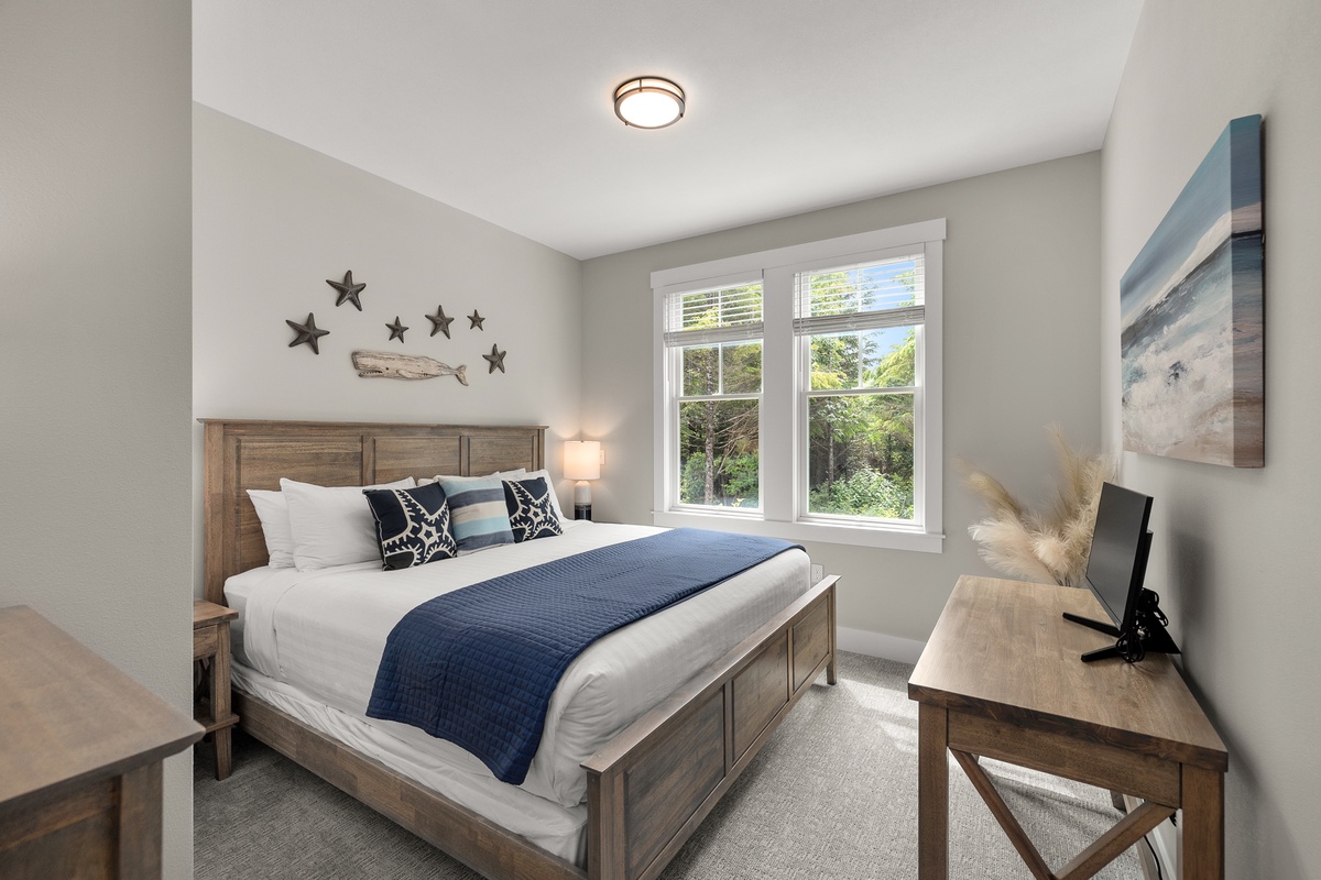 Guest king bedroom with tranquil forest views