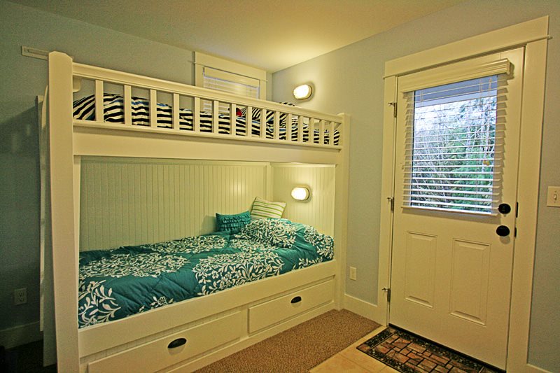 Bunk bedroom and door to outside