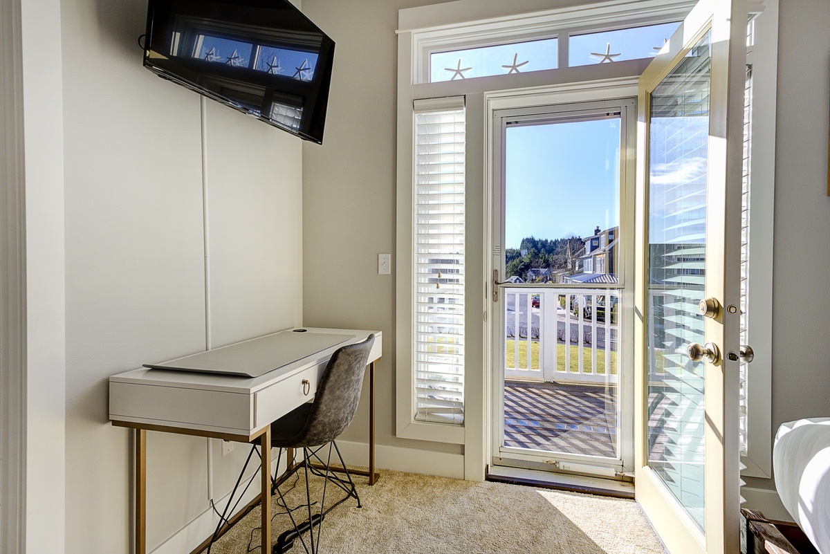 Primary with balcony and desk