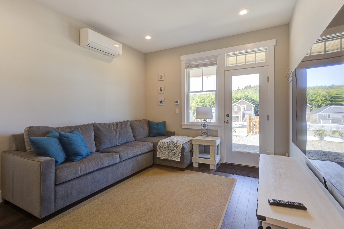 Downstairs media room with a full sofa sleeper