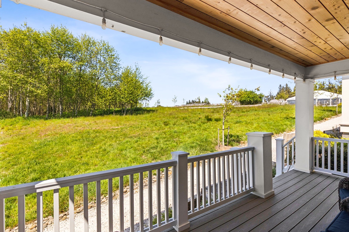 Covered deck with meadow views
