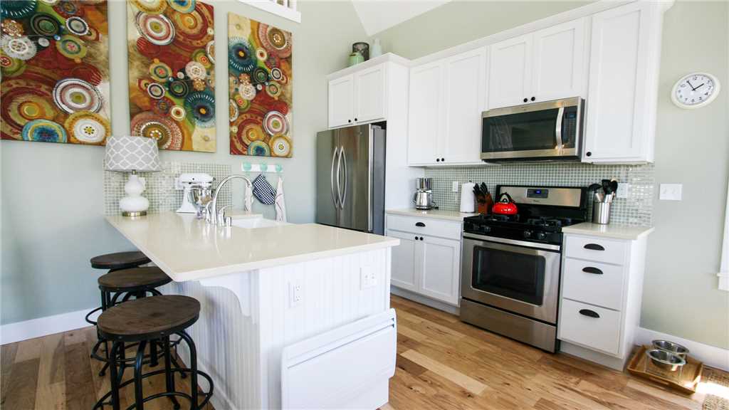 Second floor kitchen with island and bar stools