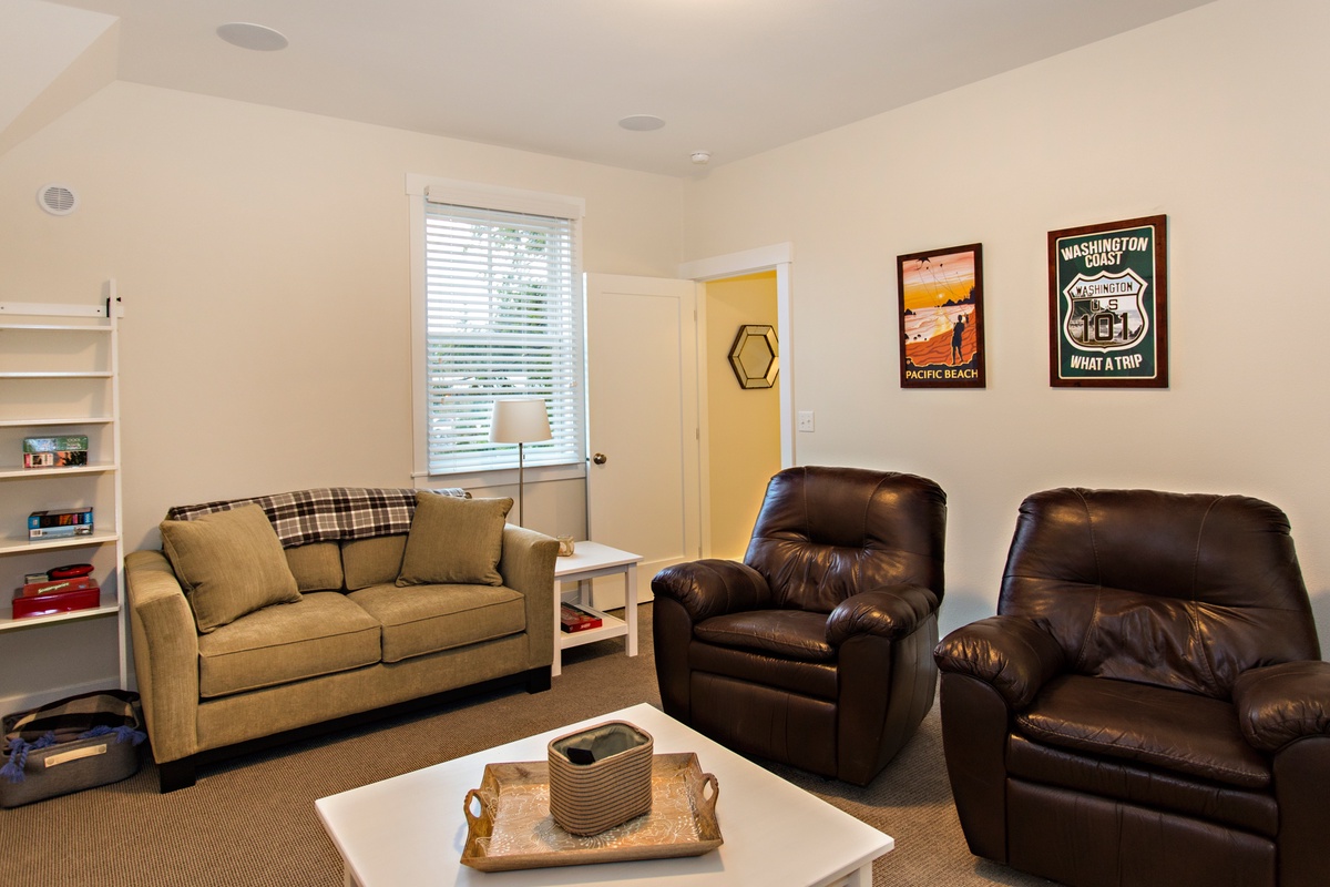 Media room with sofa and leather reclining chairs