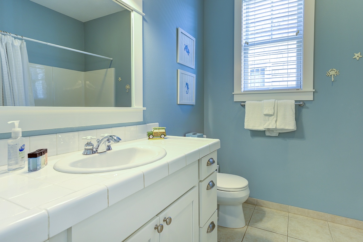 The ensuite bathroom offers a spa-like retreat