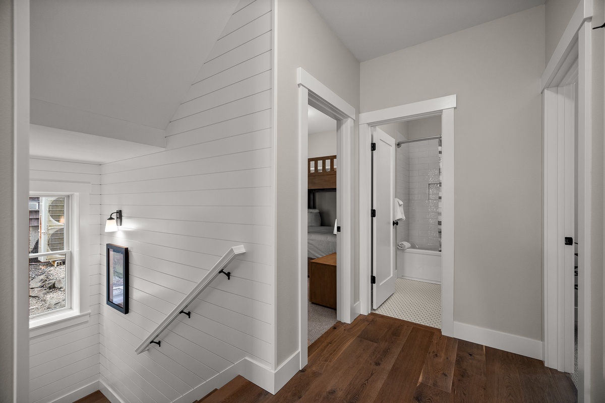 Neighboring bunk bedroom and full bath