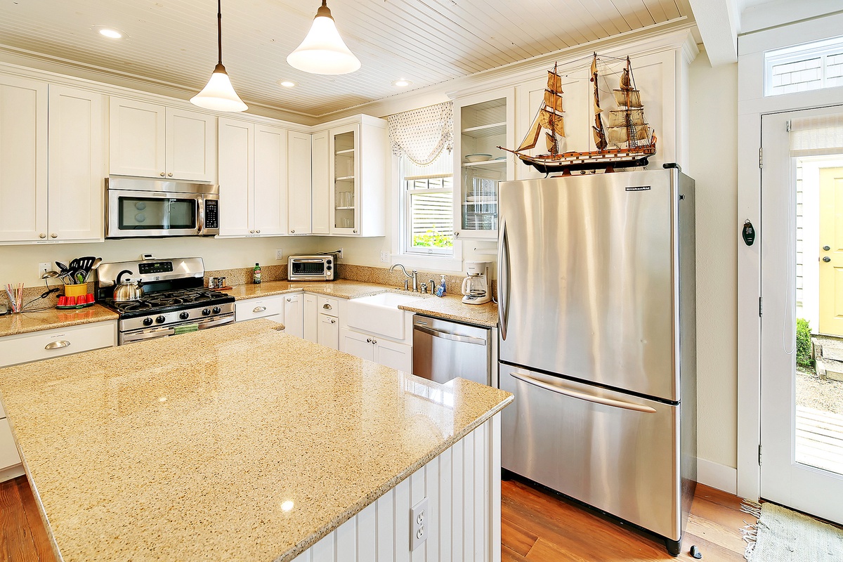 Kitchen has a large island and plenty of counter space