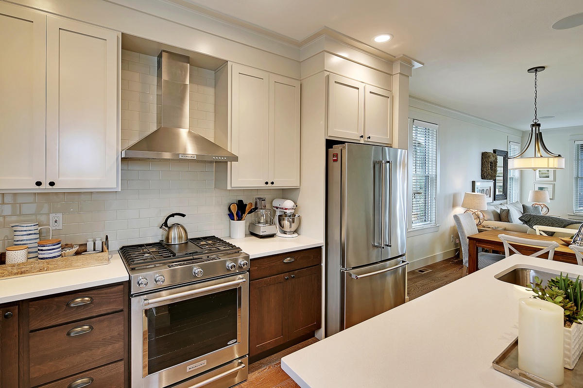 Beautiful kitchen with gas range and stainless steel appliances