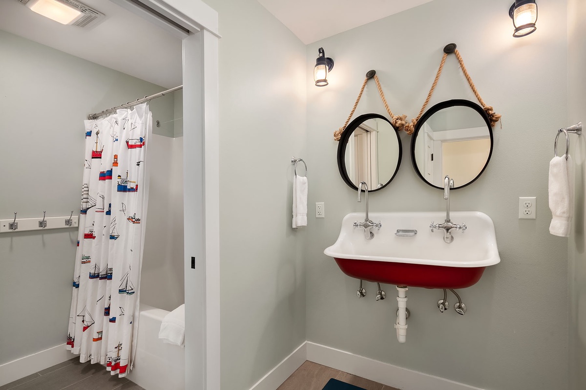 Bunkroom bathroom designed for multiple use at one time. Separate dressing, shower, sink, toilet