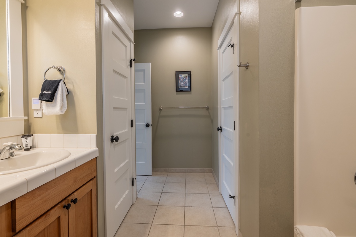 The ensuite bathroom offers a spa-like retreat for a refreshing stay