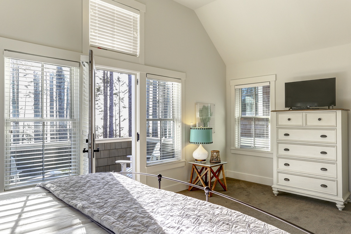 Top floor primary bedroom with ocean view balcony