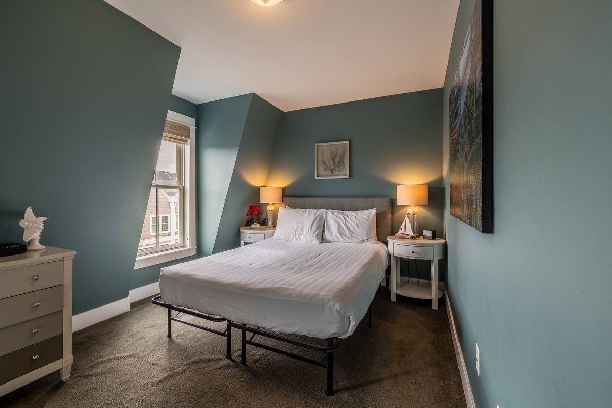 The queen guest bedroom is perfect for a restful and comfortable stay