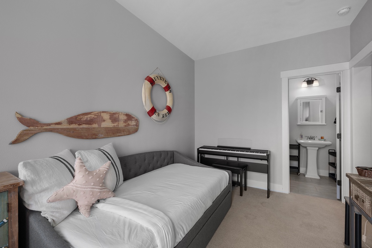 Media room with twin trundle bed