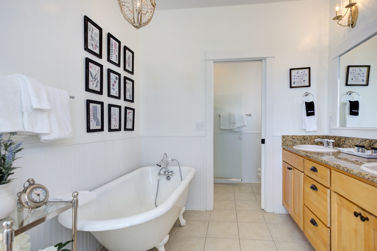The ensuite bathroom offers a spa-like retreat