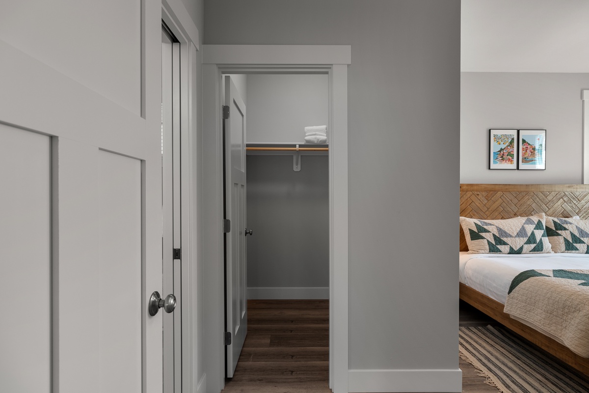 Primary bedroom walk-in closet