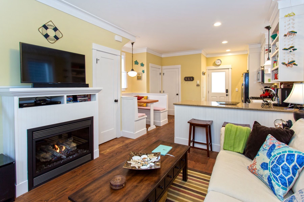 Living room with gas fireplace and tv