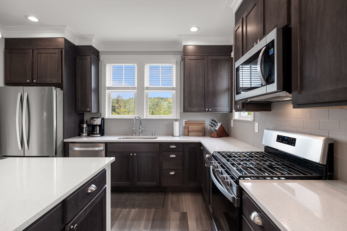 The kitchen has beautiful forest views