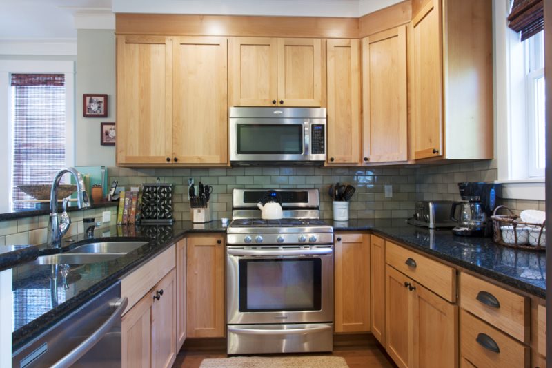 Stainless steel appliances, including a gas cook top and convection oven with a warming drawer
