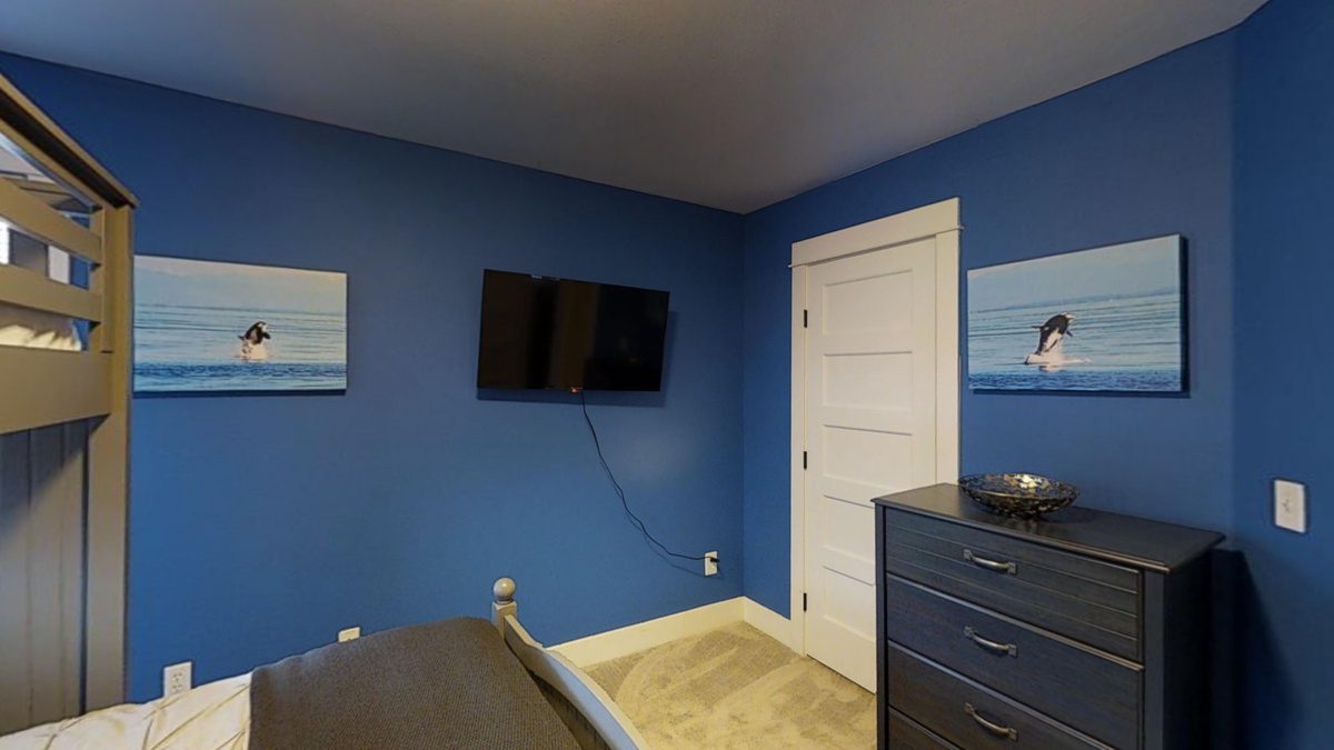 Bunk room with flat screen TV