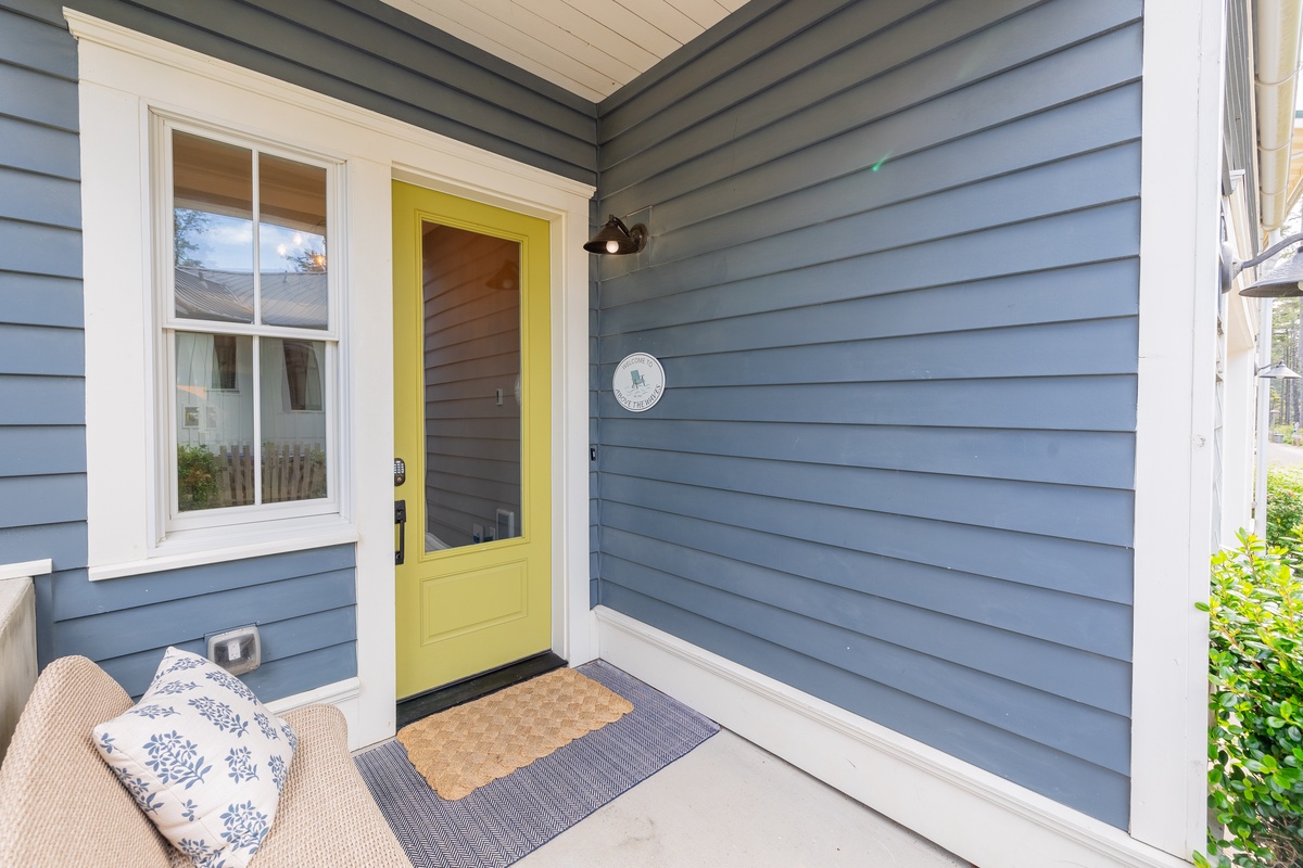 Bright yellow front door greets you