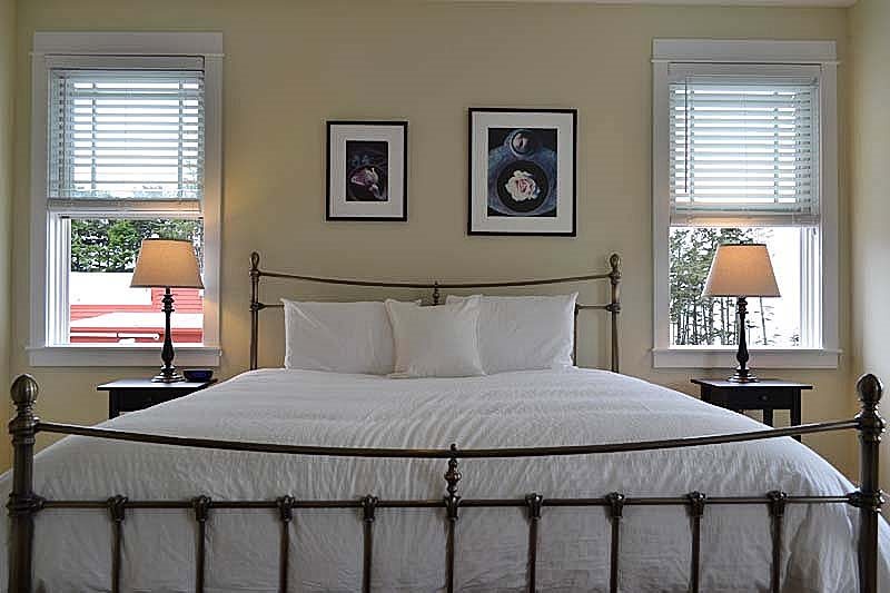 The primary bedroom is designed for a restful night's sleep