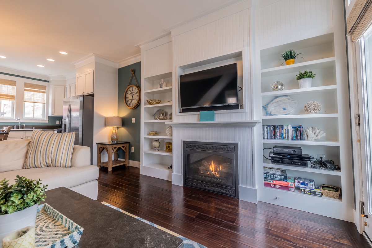 Living room with TV and fireplace