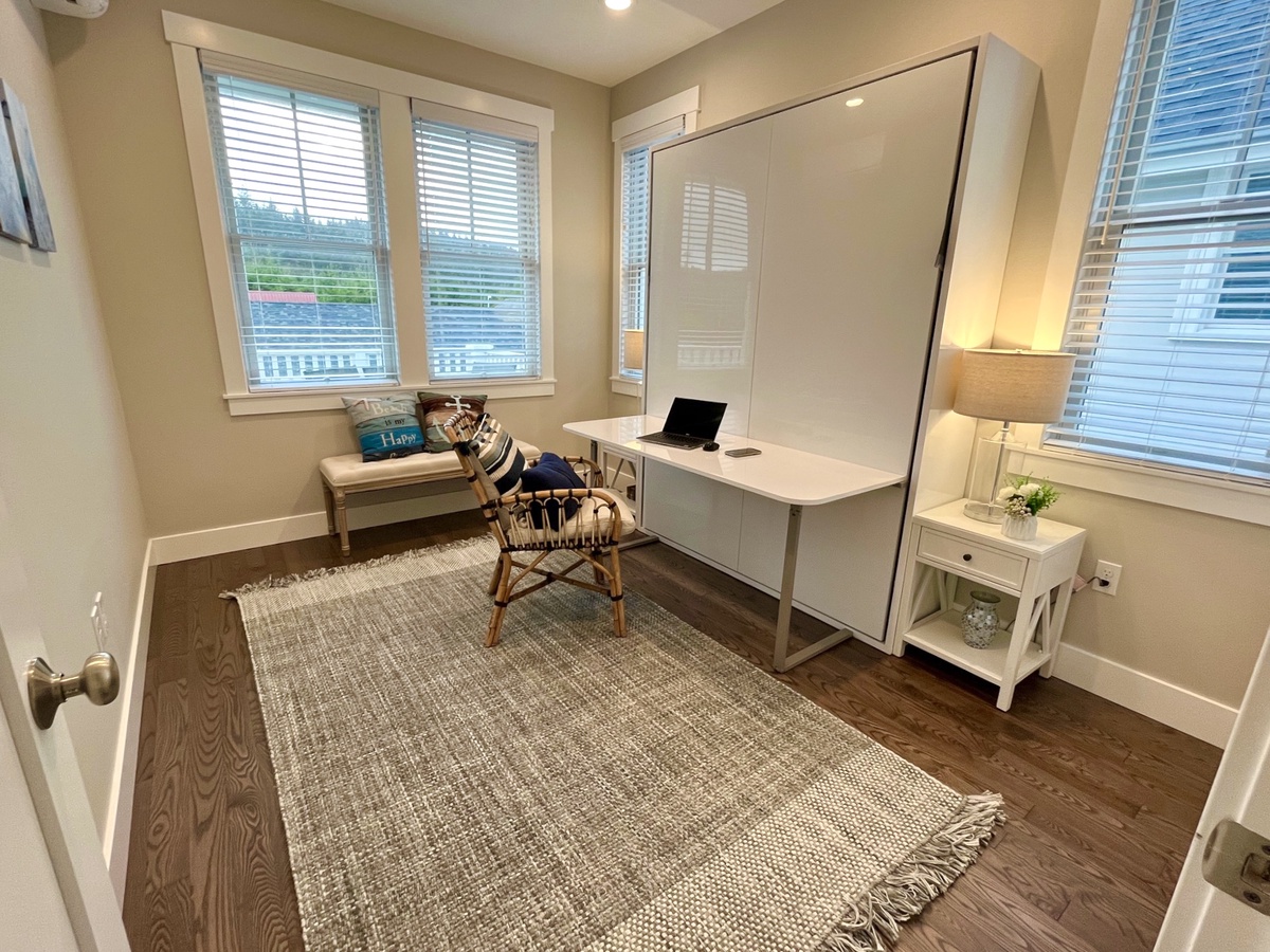 Stowing the Murphy bed reveals a desk