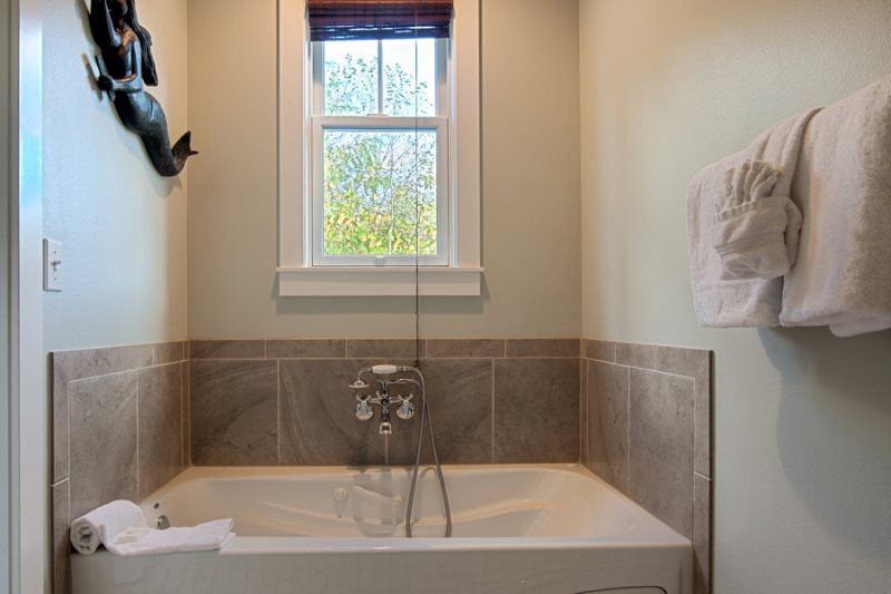 Main floor - heated and jetted soaking tub, a large walk-in shower