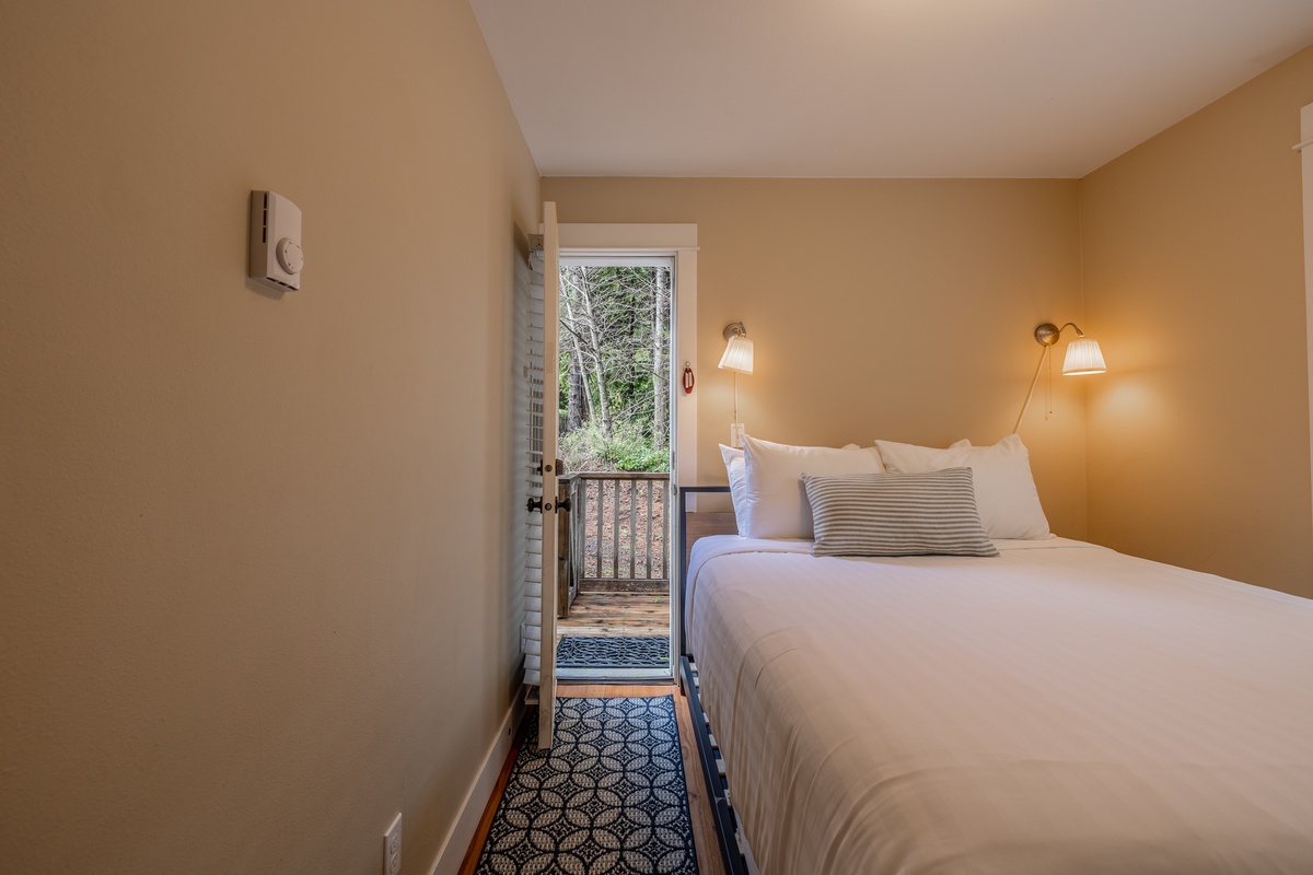 Primary Bedroom with walkway to back porch