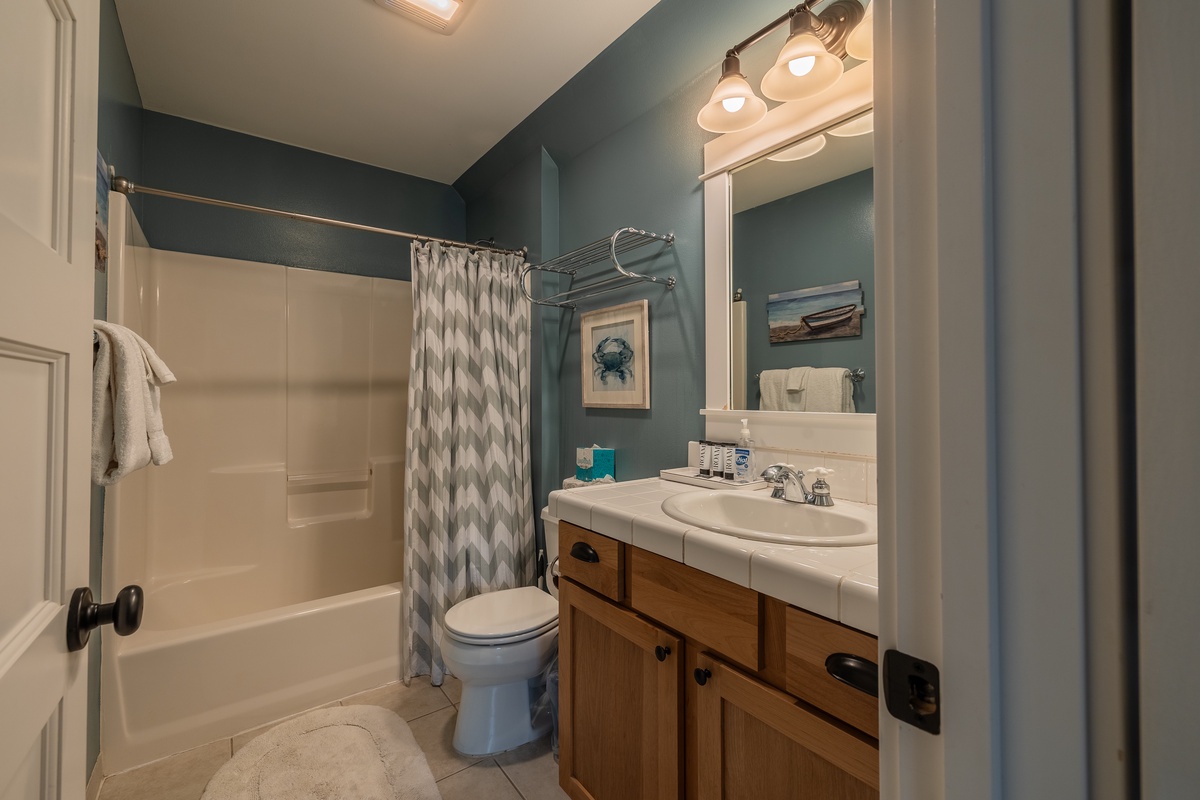 The bunk room ensuite features a tub perfect for a relaxing soak