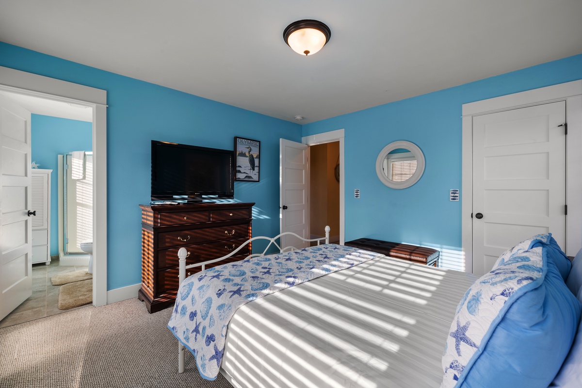 Get a restful night's sleep in the cozy primary bedroom