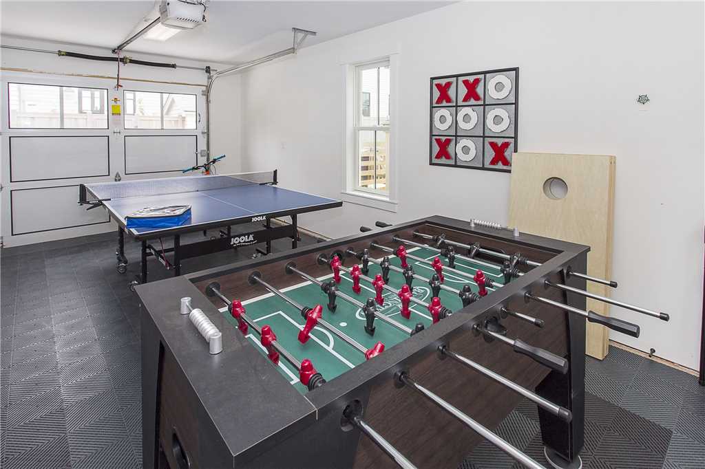 Game garage with ping pong table and foos ball table