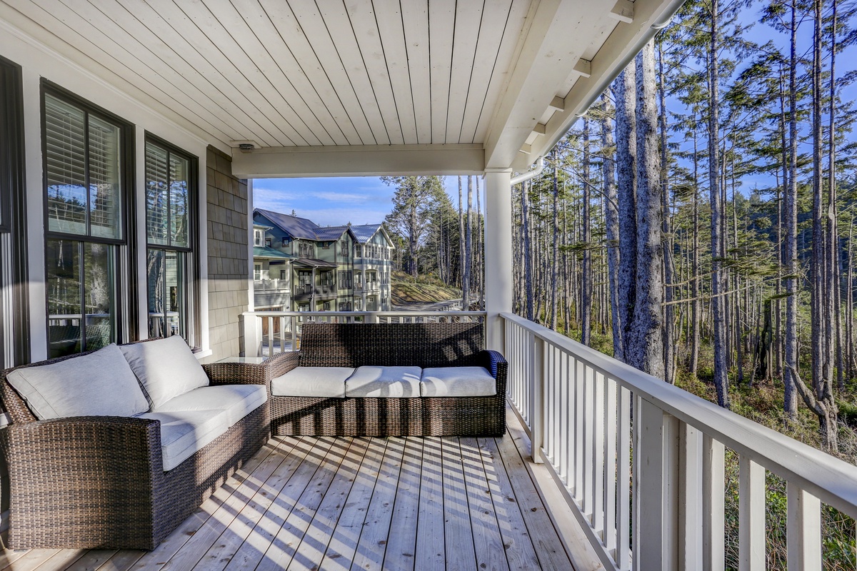 Main level deck with outdoor furniture and ocean view