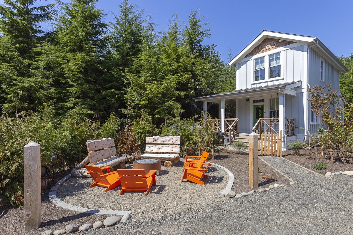 the community fire pit is steps from the porch