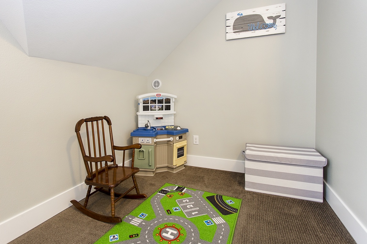 Kids corner with kitchen play set and other toys