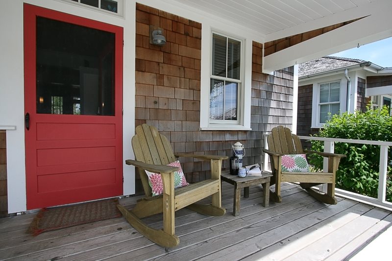 Front porch has a bistro dining set perfect for morning French press coffee
