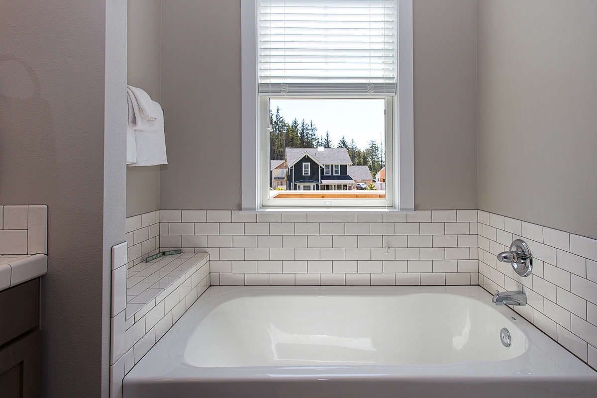 Soak in the views of Horseshoe Park in your primary bath