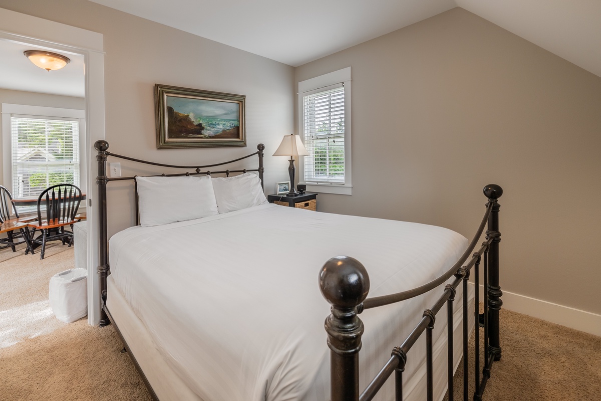 The carriage house bedroom offers tranquility for a restful stay