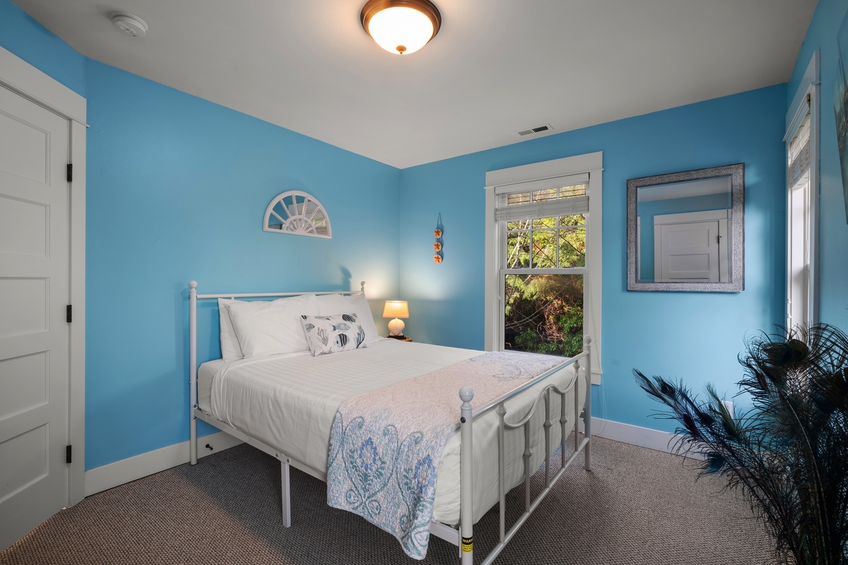 The spacious queen bedroom offers comfort, style and relaxation