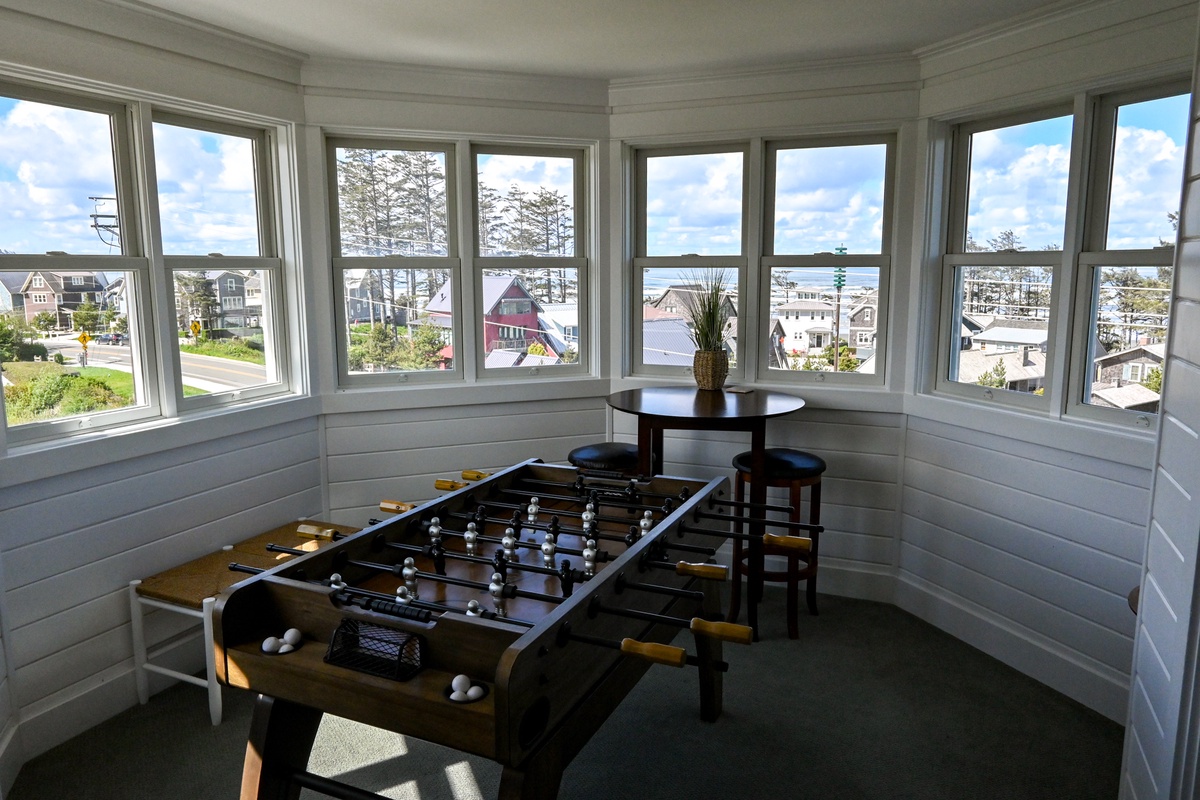 Play a game of Foosball table while enjoying a view of the ocean