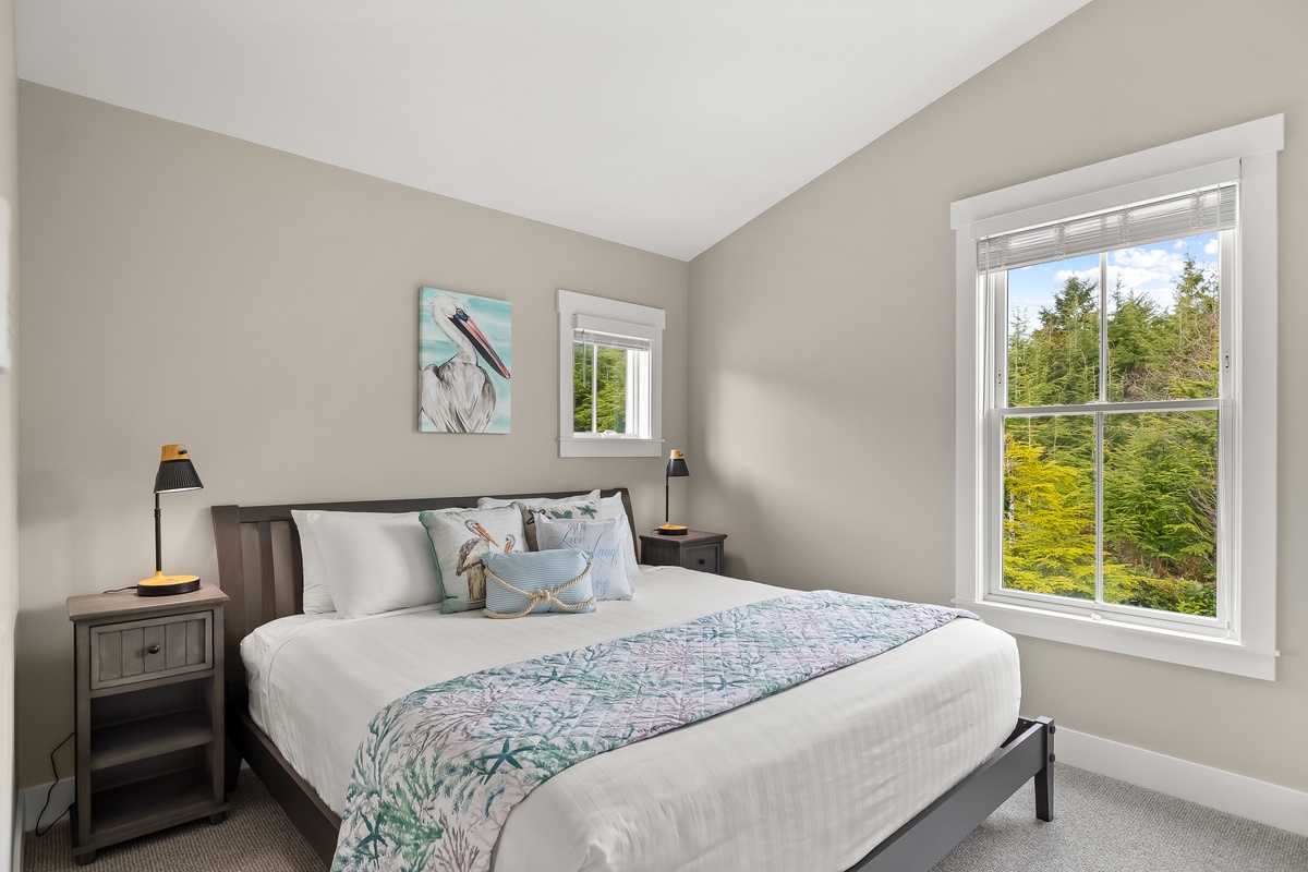 Primary king bedroom with forest views