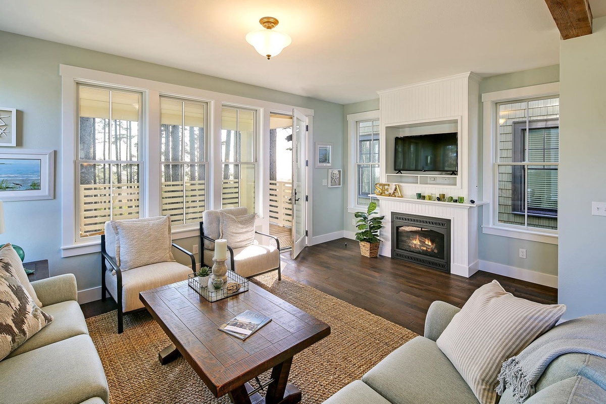 Living room with gas fireplace and tv