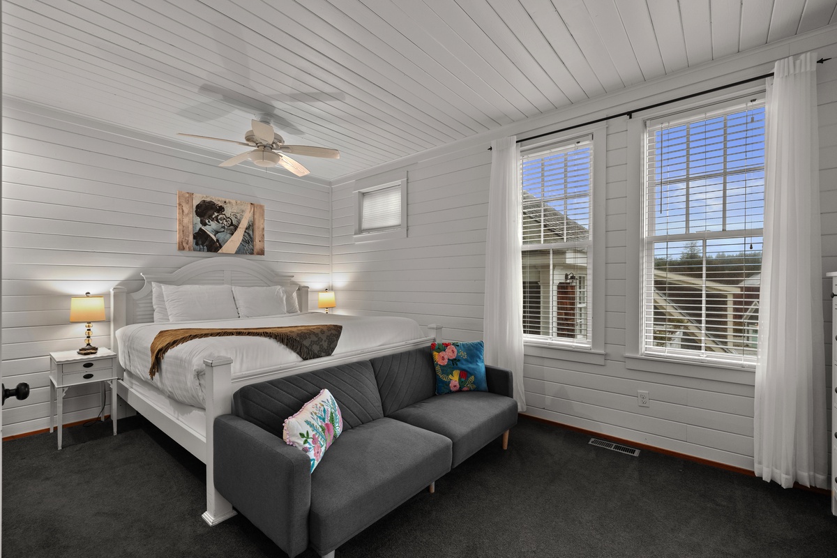 primary bedroom with balcony and ensuite bathroom